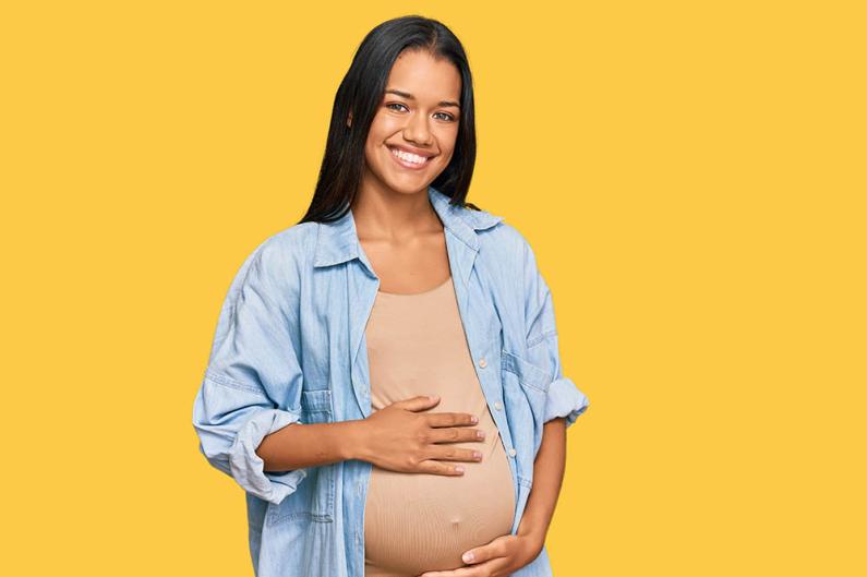 Pregnant Woman with Yellow Background 1000
