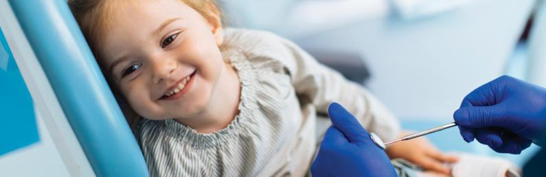 young girl in dental chair 1600x522